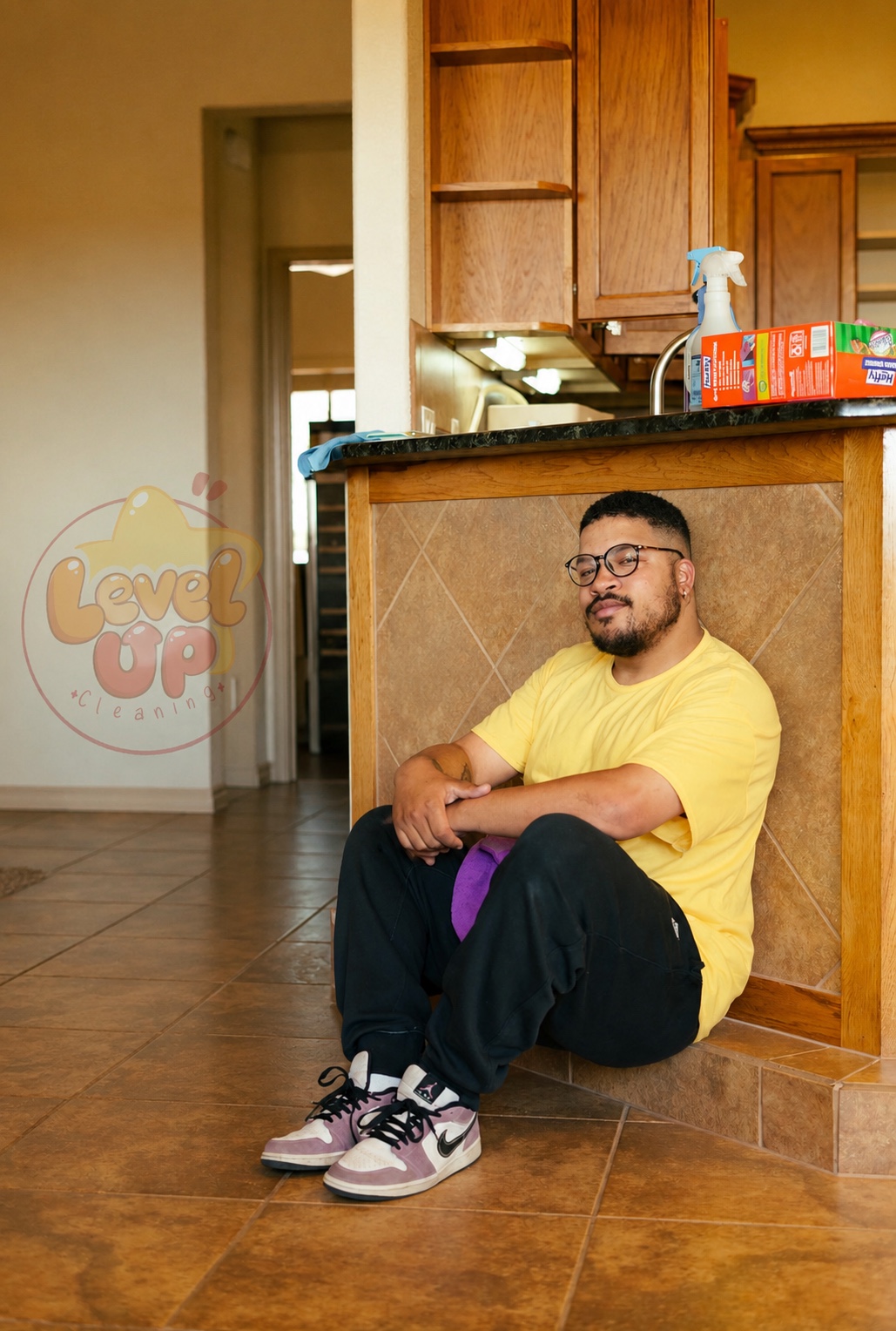Jerome, owner of LevelUp Cleaning, sitting in a clean kitchen